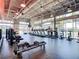 Spacious gym with modern equipment, large windows, high ceilings, and natural light at 8638 Finsen St, Orlando, FL 32827