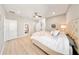 Cozy bedroom with hardwood floors, a plush bed, and ample natural light at 8638 Finsen St, Orlando, FL 32827