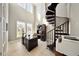 Bright office with spiral staircase, tall windows, and built-in desk at 8638 Finsen St, Orlando, FL 32827