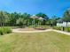 Community playground with shade, mature landscaping, and seating areas at 8638 Finsen St, Orlando, FL 32827