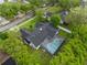 An aerial view of a charming home with a backyard screened pool at 1012 Willa Lake Cir, Oviedo, FL 32765