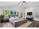 Bedroom with modern design, neutral colors, and access to closet with backyard views at 1012 Willa Lake Cir, Oviedo, FL 32765