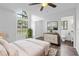 Bright bedroom with a large window, ceiling fan, and ensuite bathroom access at 1012 Willa Lake Cir, Oviedo, FL 32765