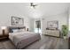 Bright bedroom with vaulted ceilings, sliding glass doors to pool, and modern decor at 1012 Willa Lake Cir, Oviedo, FL 32765