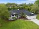 A charming home with a well-manicured lawn and mature trees, perfect for enjoying the outdoors at 1012 Willa Lake Cir, Oviedo, FL 32765