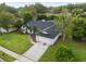 Aerial shot of a home featuring a well manicured lawn, and a two car garage at 1012 Willa Lake Cir, Oviedo, FL 32765
