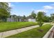 Charming home with a well-manicured front lawn, complemented by mature trees and a welcoming entrance at 1012 Willa Lake Cir, Oviedo, FL 32765