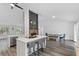 Modern kitchen with an island, seating, stainless steel appliances, and hardwood floors at 1012 Willa Lake Cir, Oviedo, FL 32765