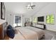 Bright main bedroom with ensuite bathroom featuring a large closet, and backyard views at 1012 Willa Lake Cir, Oviedo, FL 32765