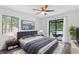 Bright bedroom featuring neutral decor, ceiling fan and sliding glass door that leads to the patio at 1012 Willa Lake Cir, Oviedo, FL 32765