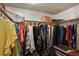 Walk-in closet with shelving and hanging rods provides ample storage space at 102 Fairway Dr # 102, Longwood, FL 32779