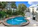 Inviting community pool surrounded by lush landscaping, perfect for enjoying a refreshing swim at 102 Fairway Dr # 102, Longwood, FL 32779