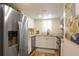 A bright kitchen with stainless steel appliances, white cabinets, and a window at 102 Fairway Dr # 102, Longwood, FL 32779