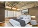 A spacious main bedroom with vaulted ceilings and exposed wooden beams at 102 Fairway Dr # 102, Longwood, FL 32779
