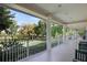 Relaxing outdoor porch area with views of the lake and surrounding green spaces at 102 Fairway Dr # 102, Longwood, FL 32779