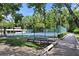 Well-maintained community tennis court surrounded by lush trees, providing a great space for exercise at 102 Fairway Dr # 102, Longwood, FL 32779