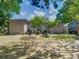 Backyard featuring mature trees, shed, patio, and an outdoor grill at 106 Alhambra Ave, Altamonte Springs, FL 32714
