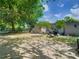 Backyard featuring a shed, mature trees and a grill and outdoor seating at 106 Alhambra Ave, Altamonte Springs, FL 32714