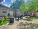 Expansive backyard with seating, storage shed, mature trees, and a grill at 106 Alhambra Ave, Altamonte Springs, FL 32714