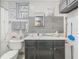 Bathroom featuring stylish grey wood-look tile and dark vanity at 106 Alhambra Ave, Altamonte Springs, FL 32714