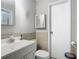 Compact bathroom featuring a sink, toilet, and medicine cabinet at 106 Alhambra Ave, Altamonte Springs, FL 32714