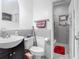 Cozy bathroom featuring a dark wood vanity, and tile walls at 106 Alhambra Ave, Altamonte Springs, FL 32714