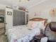 Cozy bedroom features a floral patterned bed, a large wardrobe, and a comfortable leather recliner at 106 Alhambra Ave, Altamonte Springs, FL 32714