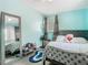 Cozy bedroom featuring a bed, full-length mirror, and decor at 106 Alhambra Ave, Altamonte Springs, FL 32714
