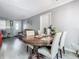 Open dining space with hardwood floors, a chandelier, and view to living room, ideal for Gathering gatherings at 106 Alhambra Ave, Altamonte Springs, FL 32714