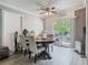Bright dining area featuring hardwood floors, a modern ceiling fan, and sliding doors to the outdoor space at 106 Alhambra Ave, Altamonte Springs, FL 32714