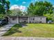 Well-maintained single-story home with a cozy front porch and mature landscaping creating great curb appeal at 106 Alhambra Ave, Altamonte Springs, FL 32714