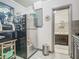 Kitchen features stainless steel appliances and view to bathroom at 106 Alhambra Ave, Altamonte Springs, FL 32714