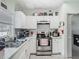 Well-lit kitchen featuring stainless steel appliances, white subway tile backsplash, and ample cabinet space at 106 Alhambra Ave, Altamonte Springs, FL 32714