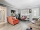 Relaxing living room with hardwood floors, comfortable seating, and a bright, airy feel, great for Gathering time at 106 Alhambra Ave, Altamonte Springs, FL 32714