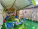 Enclosed patio featuring outdoor seating, artificial turf, and overhead cover at 106 Alhambra Ave, Altamonte Springs, FL 32714