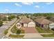 Well-maintained home with brick-paved driveway, landscaped lawn, and convenient two-car garage at 1199 Playa Del Sol Ln, St Cloud, FL 34771