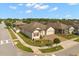 Attractive home featuring manicured lawn, brick-paved driveway and two-car garage in quiet neighborhood at 1199 Playa Del Sol Ln, St Cloud, FL 34771