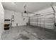 Spacious two car garage with automatic door and clean, painted walls at 1199 Playa Del Sol Ln, St Cloud, FL 34771