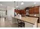 Stylish kitchen featuring granite countertops, pendant lights, and stainless steel appliances at 1199 Playa Del Sol Ln, St Cloud, FL 34771