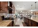 Bright kitchen with granite countertops, stainless steel appliances, and adjacent dining area at 1199 Playa Del Sol Ln, St Cloud, FL 34771