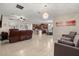 Spacious living area with tile flooring open to kitchen and dining at 1199 Playa Del Sol Ln, St Cloud, FL 34771