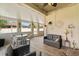 Enclosed patio featuring tile flooring, ceiling fan, seating, and decor at 1199 Playa Del Sol Ln, St Cloud, FL 34771
