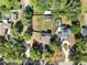 Bird's-eye view showcases the home, pool, and large yard, all enclosed by a sturdy wooden fence at 12030 Kirby Smith Rd, Orlando, FL 32832