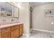 Functional bathroom featuring a vanity with a sink, a mirror, and a walk-in shower at 12030 Kirby Smith Rd, Orlando, FL 32832
