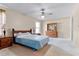 Cozy bedroom features neutral walls, carpet flooring, and a ceiling fan for comfortable living at 12030 Kirby Smith Rd, Orlando, FL 32832