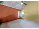Neutral room, vaulted wood ceiling, and a window for natural light, enhancing the overall spaciousness at 12030 Kirby Smith Rd, Orlando, FL 32832