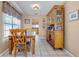 Comfortable dining room with a dining table, matching hutch, and a window at 12030 Kirby Smith Rd, Orlando, FL 32832