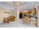 Spacious kitchen with an island bar, wooden cabinets, and lots of natural lighting at 12030 Kirby Smith Rd, Orlando, FL 32832