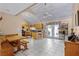 Open kitchen with tile floors, a breakfast bar, and sliding glass doors to the backyard at 12030 Kirby Smith Rd, Orlando, FL 32832