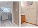 Practical laundry room with a washer and dryer, featuring tiled flooring and window at 12030 Kirby Smith Rd, Orlando, FL 32832